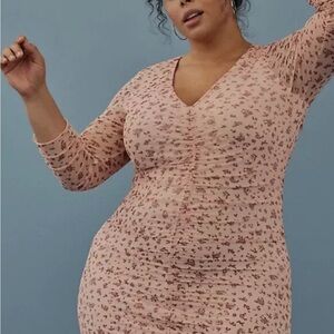 Pink dress with mesh pink flower overlay.